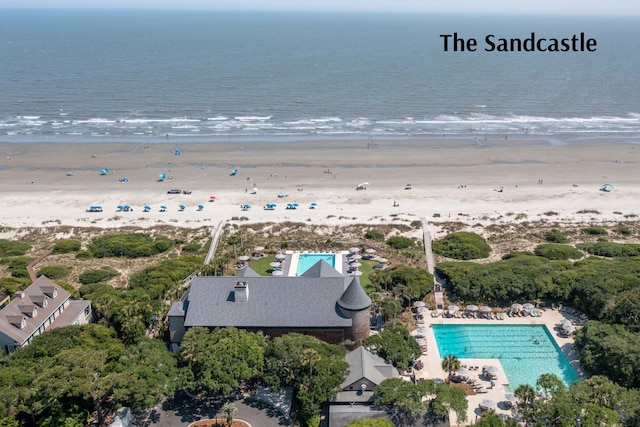 bird's eye view featuring a water view and a view of the beach