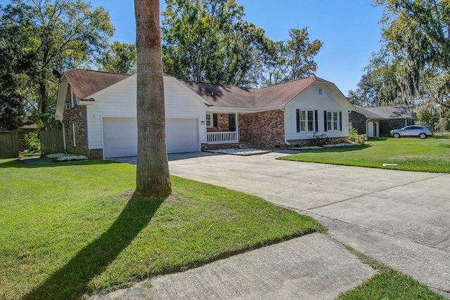 ranch-style house featuring a front yard and a garage