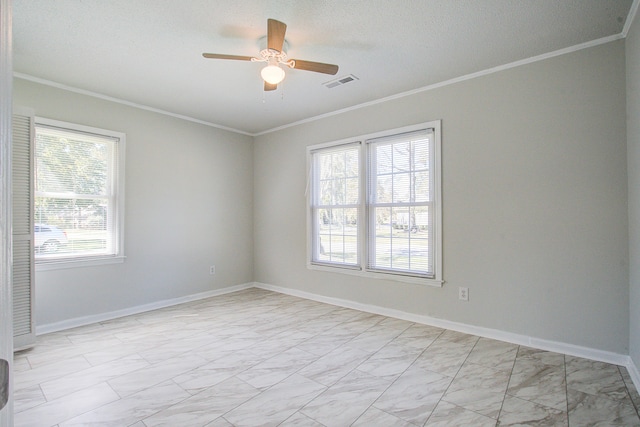 unfurnished room featuring ornamental molding, a textured ceiling, and ceiling fan