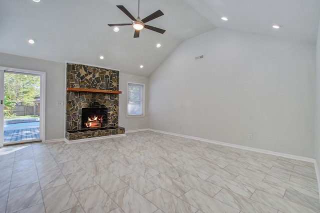 unfurnished living room with a fireplace, vaulted ceiling, and ceiling fan