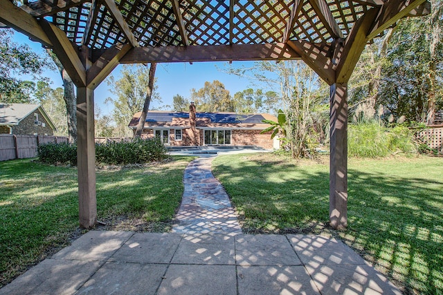 view of yard with a pergola and a patio