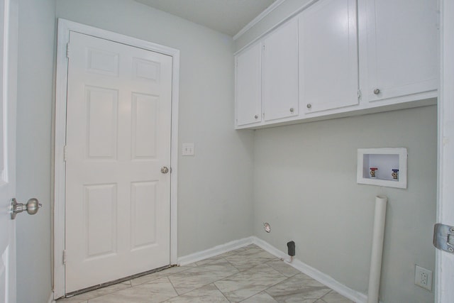 washroom featuring washer hookup and cabinets