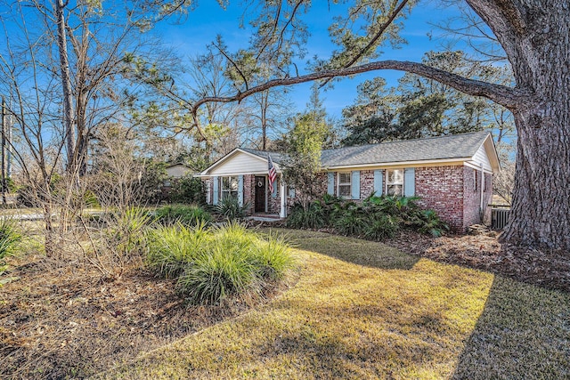 ranch-style house with a front lawn