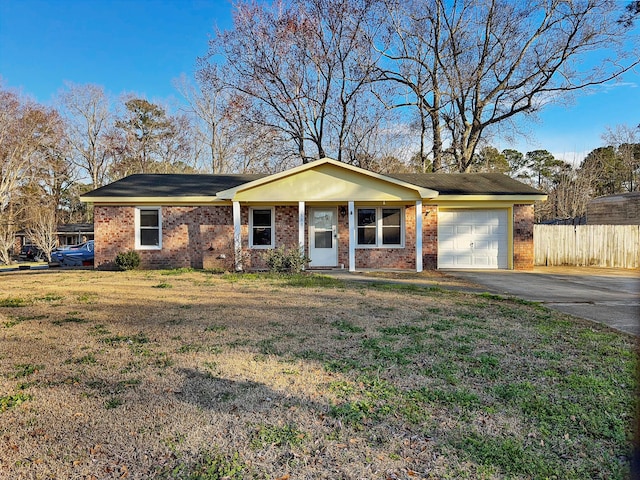 single story home with driveway, an attached garage, fence, a front lawn, and brick siding