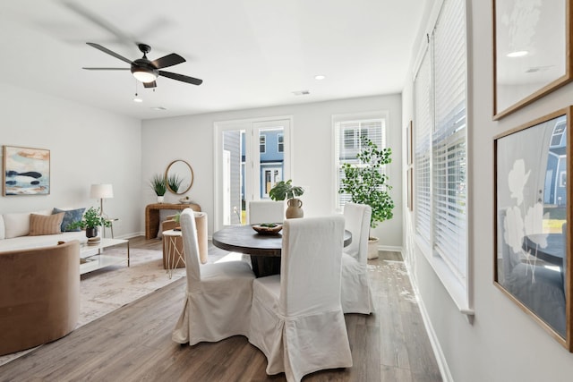 dining area featuring ceiling fan and hardwood / wood-style floors