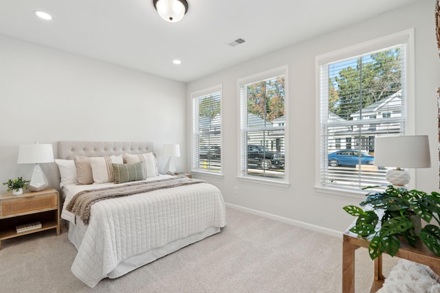 bedroom with light carpet