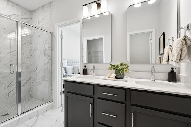 bathroom featuring vanity and a shower with door