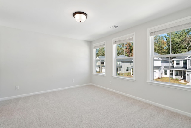 spare room featuring carpet flooring