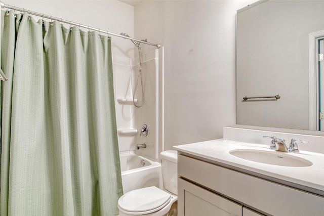 full bathroom with shower / bath combination with curtain, toilet, and vanity