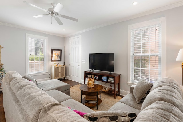 living room featuring wood finished floors, crown molding, baseboards, recessed lighting, and a ceiling fan