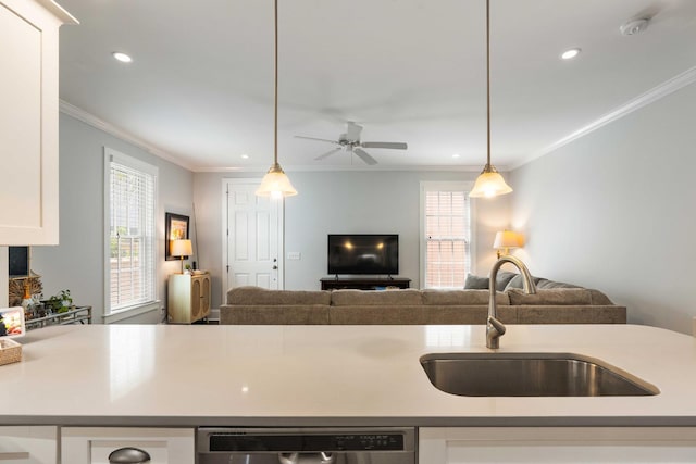 kitchen with a sink, open floor plan, stainless steel dishwasher, white cabinetry, and light countertops
