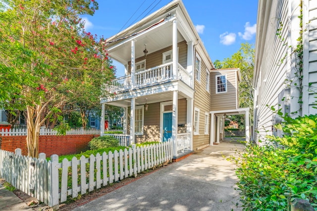 view of front of house featuring a balcony and a porch