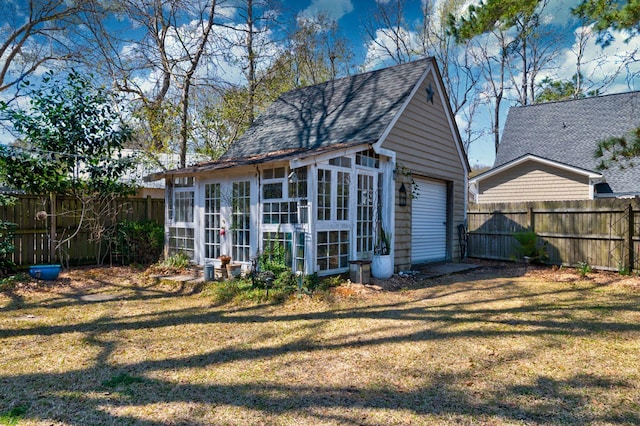 view of outdoor structure with an outbuilding and a fenced backyard