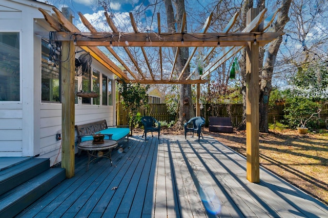 deck with fence and a pergola