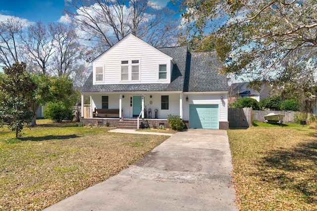 view of front of house with a garage, covered porch, a front lawn, and fence