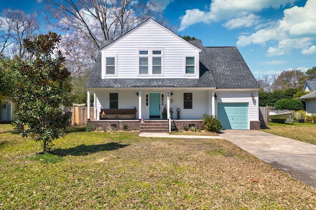 view of front of house featuring a porch, fence, a garage, and a front lawn