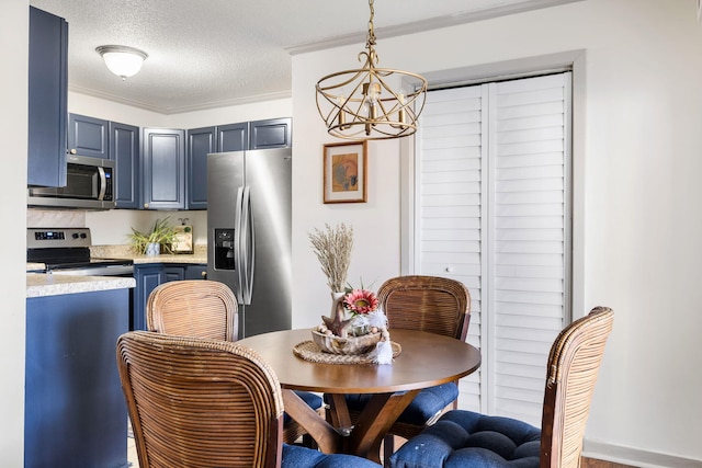 dining room with crown molding, a textured ceiling, and a chandelier