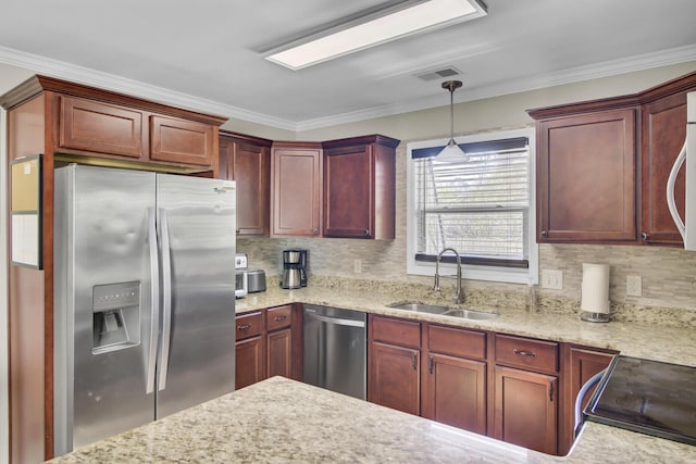 kitchen featuring pendant lighting, stainless steel appliances, a sink, backsplash, and crown molding