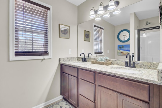 full bath featuring a wealth of natural light, a sink, and double vanity