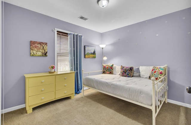 carpeted bedroom with baseboards and visible vents