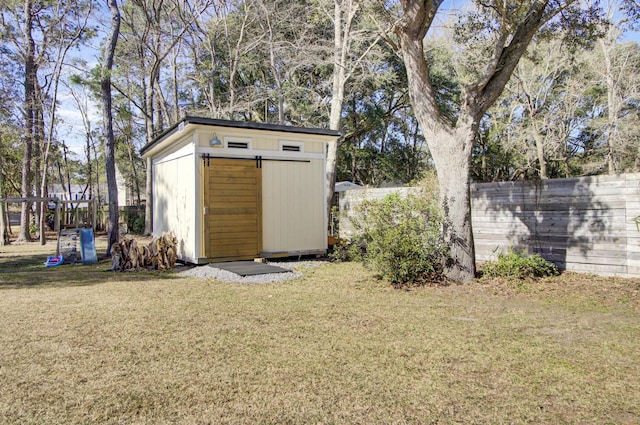 view of shed featuring a fenced backyard