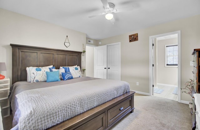 bedroom featuring baseboards, ceiling fan, visible vents, and light colored carpet