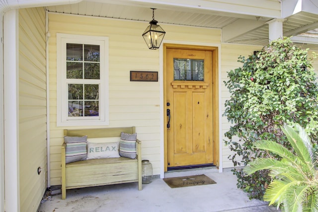 doorway to property with a porch