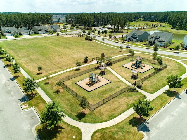 birds eye view of property with a forest view