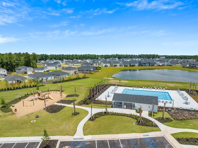 bird's eye view with a water view and a residential view