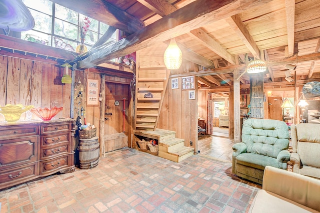 1373 Bridge St, Branchville, SC 29432 - living area featuring wooden walls, wood ceiling with exposed beams, stairs, and brick floors