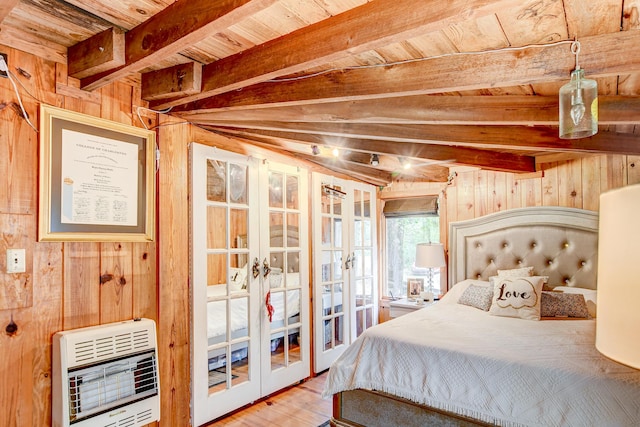 1373 Bridge St, Branchville, SC 29432 - bedroom with heating unit, wood walls, french doors, wooden ceiling with exposed beams, and wood finished floors