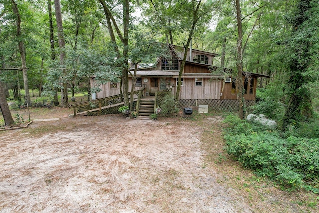 1373 Bridge St, Branchville, SC 29432 - view of front facade with a porch and a forest view