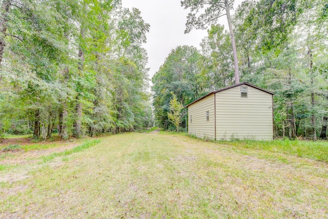 1373 Bridge St, Branchville, SC 29432 - view of grassy yard featuring an outbuilding and a forest view