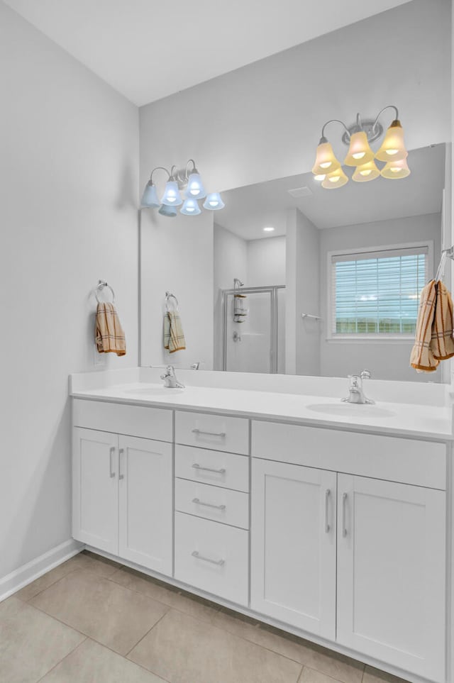 bathroom featuring vanity, tile patterned floors, and an enclosed shower