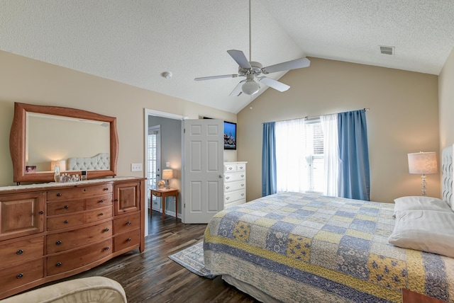 bedroom with dark wood-style flooring, visible vents, vaulted ceiling, a textured ceiling, and ceiling fan