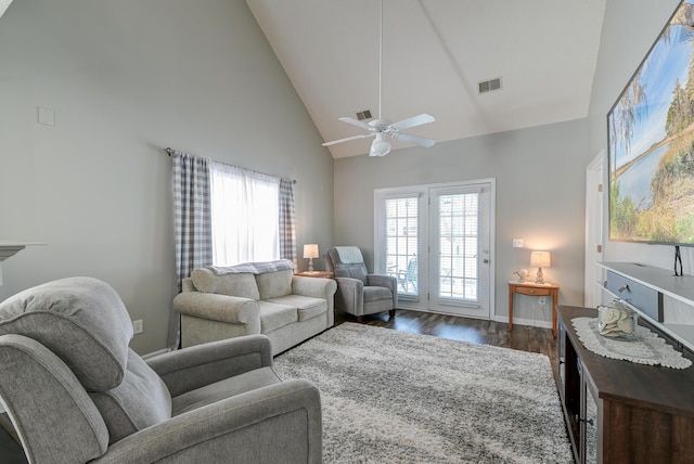 living room with dark wood-style floors, visible vents, ceiling fan, high vaulted ceiling, and baseboards