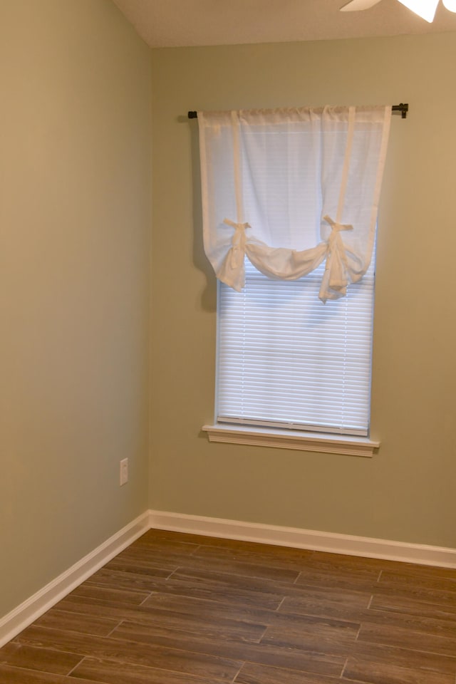 spare room with wood-type flooring and ceiling fan