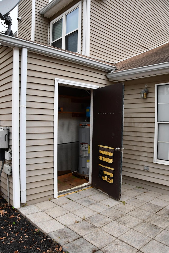 exterior space featuring water heater and a patio area