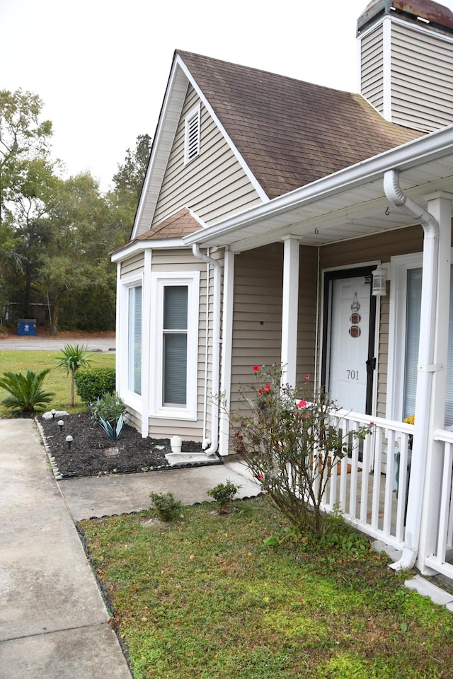 doorway to property with a porch