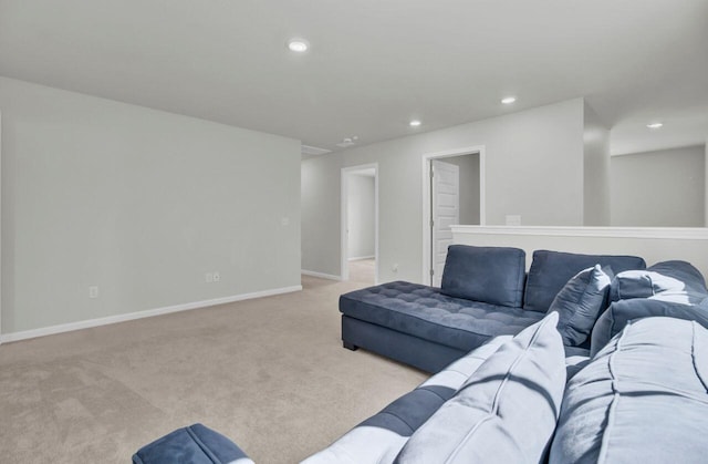 living room with baseboards, recessed lighting, and light colored carpet