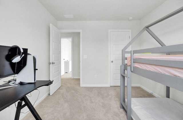 carpeted bedroom with baseboards