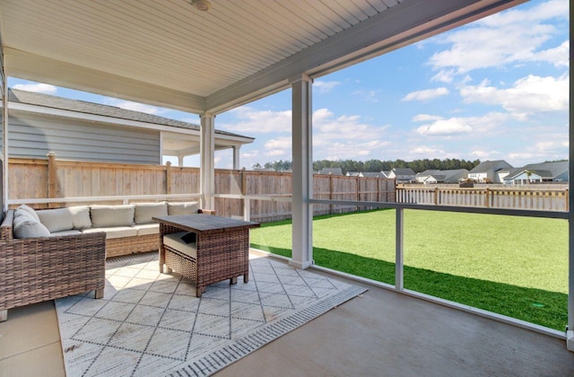 sunroom featuring a residential view