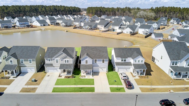 aerial view featuring a water view and a residential view