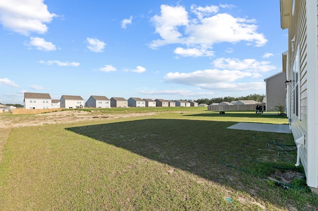 view of yard featuring a residential view