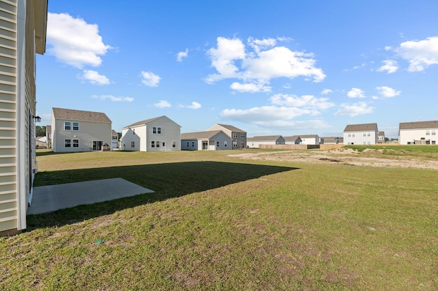 view of yard featuring a residential view