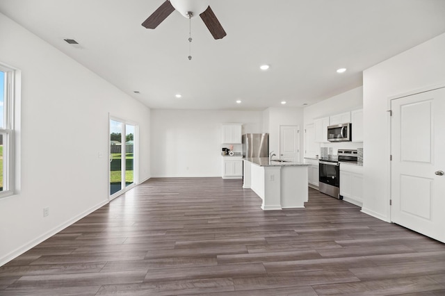 kitchen with dark wood-style floors, stainless steel appliances, visible vents, and recessed lighting