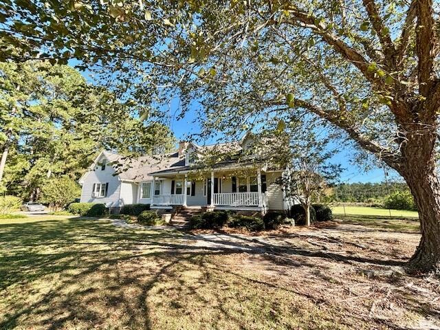 view of front of property with a front lawn and a porch