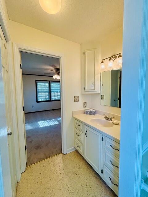 bathroom featuring vanity, a textured ceiling, and ceiling fan