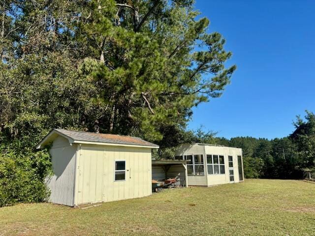 view of outbuilding featuring a lawn