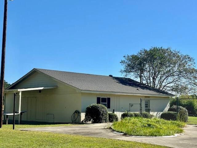 view of home's exterior with a lawn